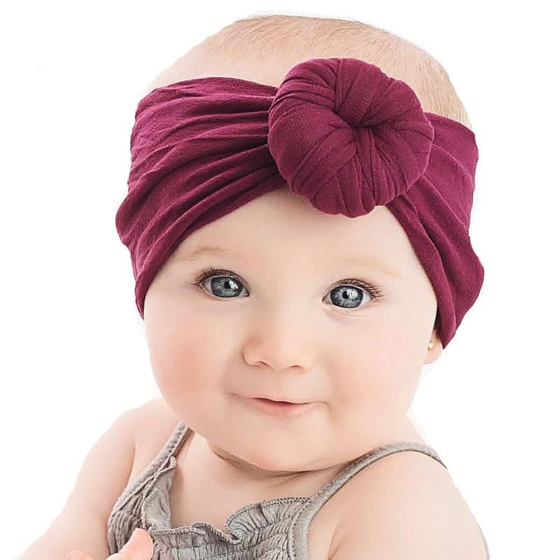 Set of three handmade baby hairbands with bows and elastics, suitable for newborns, infants, and toddlers from Everything Baby.