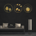 Three gold metal wall decor pieces featuring ginkgo and maple leaves, 11 inches, for bedroom wall decoration by Everything Baby.