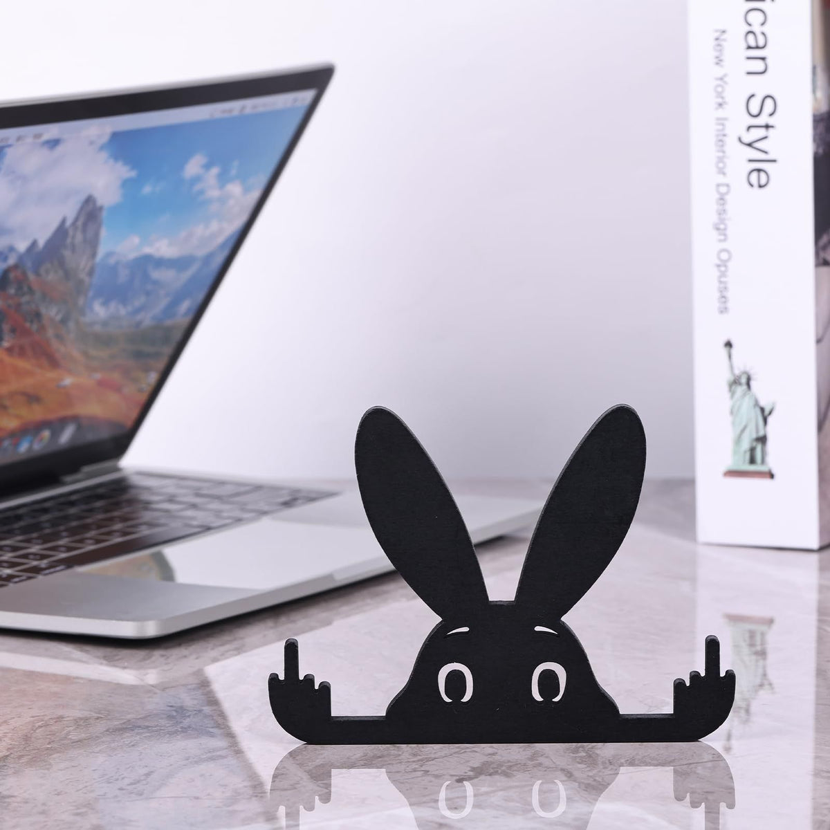 Adorable black rabbit statue with raised middle finger, 5.9-inch toy figure from Everything Baby, perfect for quirky decor or playful display.