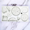 Silicone molds with strawberry, lemon, kiwi, and tangerine slices for DIY cake, fondant, cookies, soap, and pudding crafting.