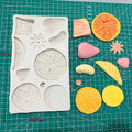 Silicone mold with strawberry, lemon, kiwi, and tangerine slices for DIY cake, fondant, cookies, soap, or pudding crafts.