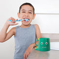 Cute dinosaur-themed plastic bathroom cup for kids, with toothbrush holder and tumbler for baby and kids' dental hygiene.