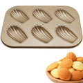 Non-stick 6-cavity oval shell mold cake pan for baking cookies, ideal for oven baking and pretend play with kids.