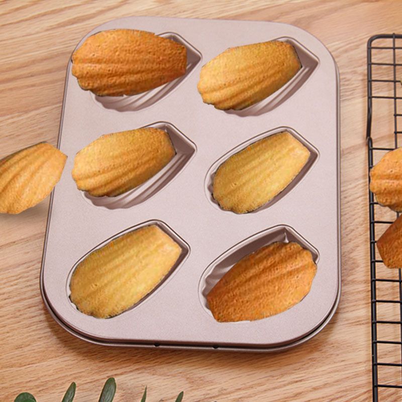 Everything Baby 6-cavity non-stick oval shell mold cake pan for oven baking, ideal for creative pretend play and baking activities.