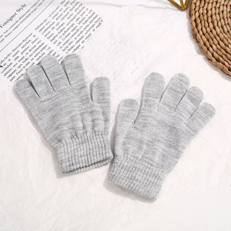 Two pairs of colorful knit magic gloves for kids, warm and stretchy, designed for girls and boys to keep hands cozy in winter.