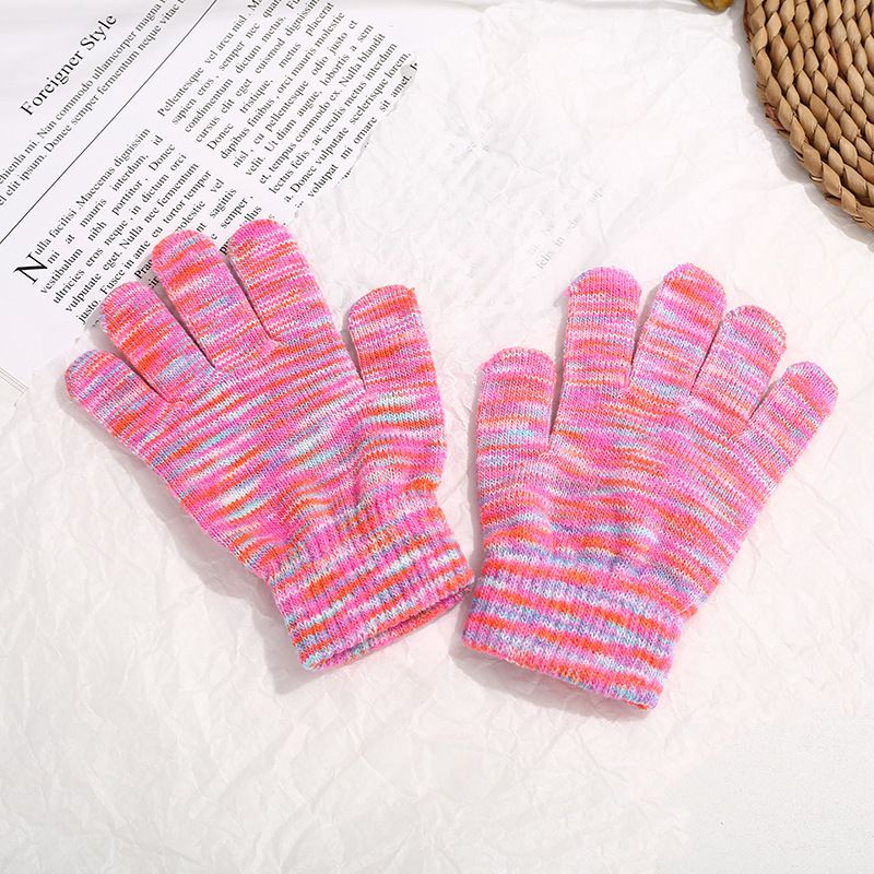 Two pairs of colorful, stretchy knit magic gloves for kids, ideal for winter warmth and playful outdoor adventures.