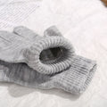 Two pairs of colorful knit magic gloves for kids, stretchy and warm, ideal for winter play and outdoor activities.