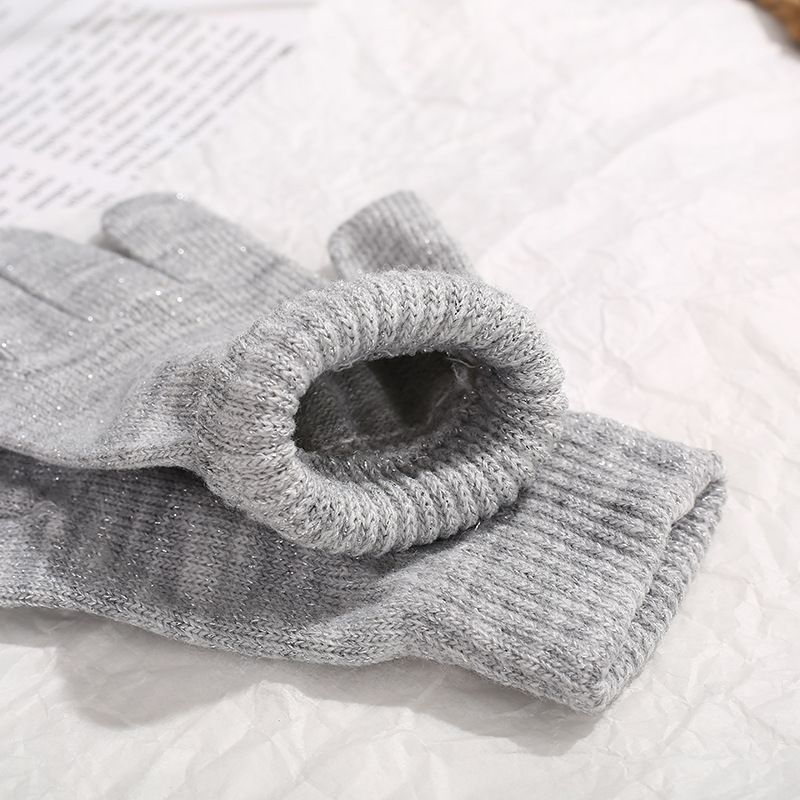 Two pairs of colorful knit magic gloves for kids, stretchy and warm, ideal for winter play and outdoor activities.