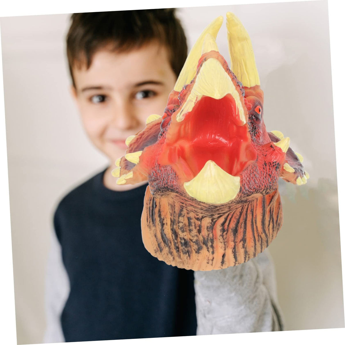 Educational Dinosaur Triceratops hand puppet toy for kids, perfect for role-play and outdoor play activities.