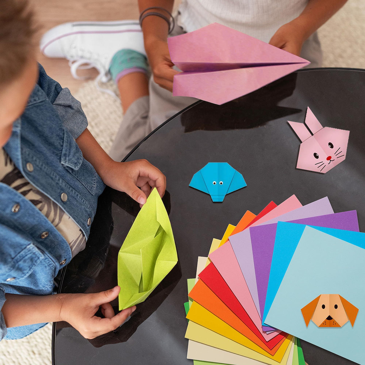 Bright colorful origami paper sheets in various double-sided shades for kids' arts and craft projects, from Everything Baby.