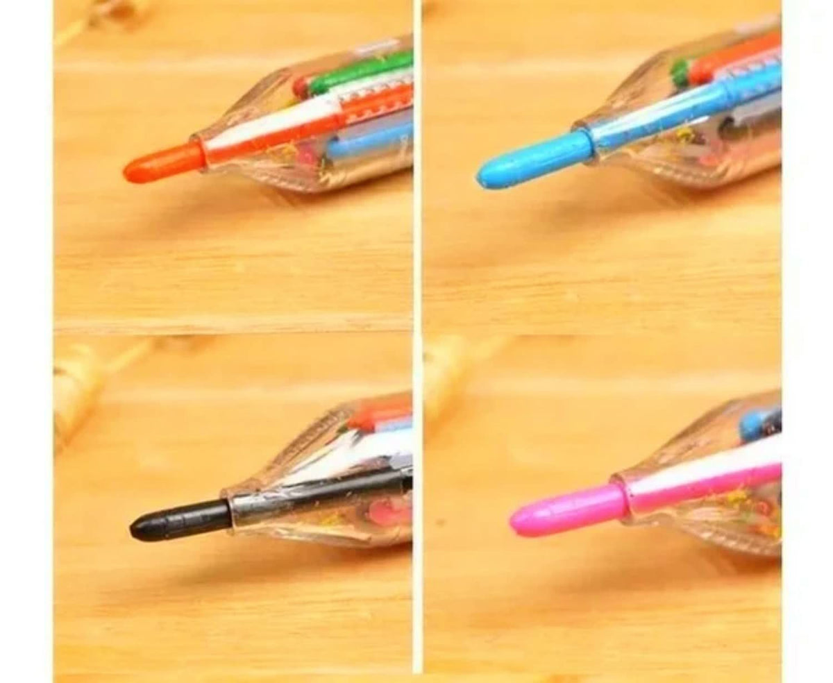 Set of 4 Everything Baby 8-in-1 press-on crayons with transparent barrels and colorful oil pastel design for kids' art and drawing.
