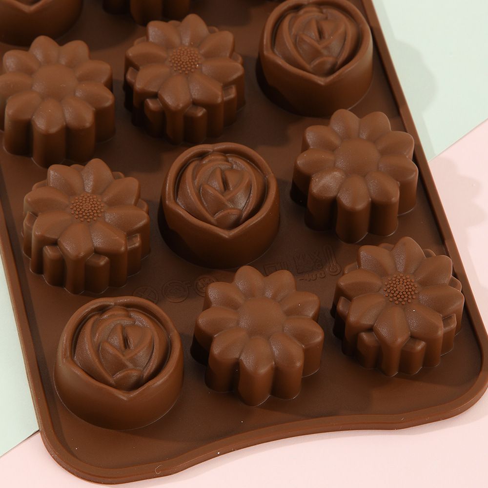 Silicone flower-shaped candy mold by Everything Baby, safe for freezer and oven, ideal for making treats for kids' pretend play.