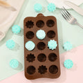 Silicone candy chocolate mold featuring flower and dinosaur shapes, safe for freezer and oven, ideal for kids' pretend play treats.