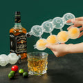 Transparent 4-cavity ice ball mold by Everything Baby for DIY round ice cubes, ideal for bar and party use.