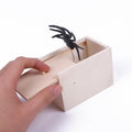 Wooden spider prank box from Everything Baby, with a pop-out rubber spider for pretend play and Halloween joke fun.