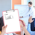 Pink translucent plastic clipboard with a low profile metal clip, ideal for office or school use by Everything Baby.