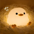 Cute duck night light for children, soft silicone sleep light with touch sensor, USB rechargeable, ideal for kids' rooms.