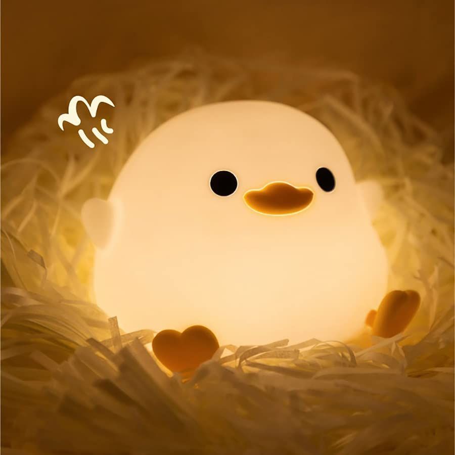 Cute duck night light for children, soft silicone sleep light with touch sensor, USB rechargeable, ideal for kids' rooms.