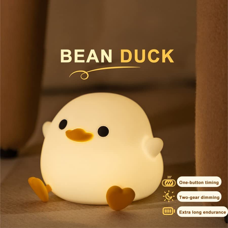 Cute silicone duck night light for children, USB rechargeable sleep light with touch sensor for kids' rooms and pretend play.