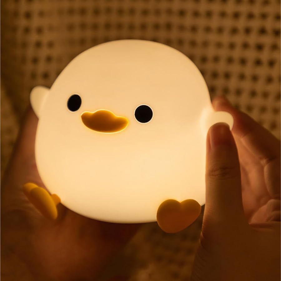 Soft silicone duck night light for kids, USB rechargeable touch sensor sleep light perfect for children's rooms and pretend play.