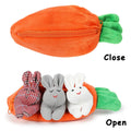 Three plush Easter bunnies in a carrot-shaped pouch, soft stuffed animals designed for babies and kids, with a zip-up surprise feature.