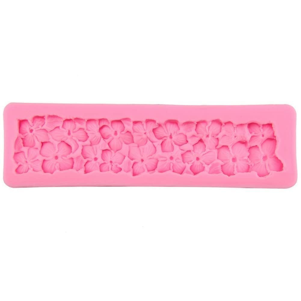 Silicone fondant mold with rose flower design for cake decorating, used in sugarcraft and cake decoration projects.