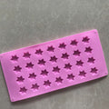 Star-shaped silicone ice cube tray and mold for chocolates, soaps, and Jello, easy-release non-stick design for baby and kids feeding.