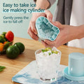 Light blue silicone ice cube tray with cylinder molds for freezing ice cubes, ideal for drinks and juices.
