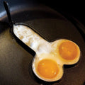 Stainless steel funny egg rings with foldable handle, shaped like white elephants, for playful egg cooking in the kitchen.