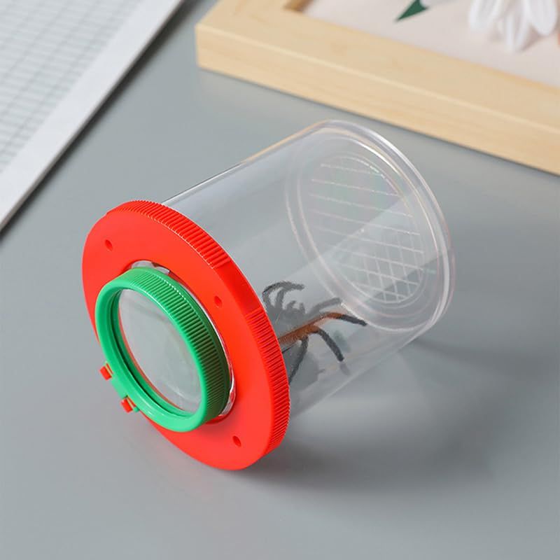 Child using Everything Baby bug viewer magnifier with insect collecting kit for outdoor bug exploration and discovery.