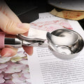 Pink stainless steel ice cream scoop with trigger, perfect for fruit balls and baby feeding, by Everything Baby.