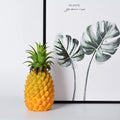 Realistic artificial pineapple toy for pretend play, suitable for home decor and kids' play areas, by Everything Baby.