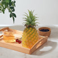Realistic artificial pineapple toy for pretend play, suitable for home, cabinet, or party decor, by Everything Baby.