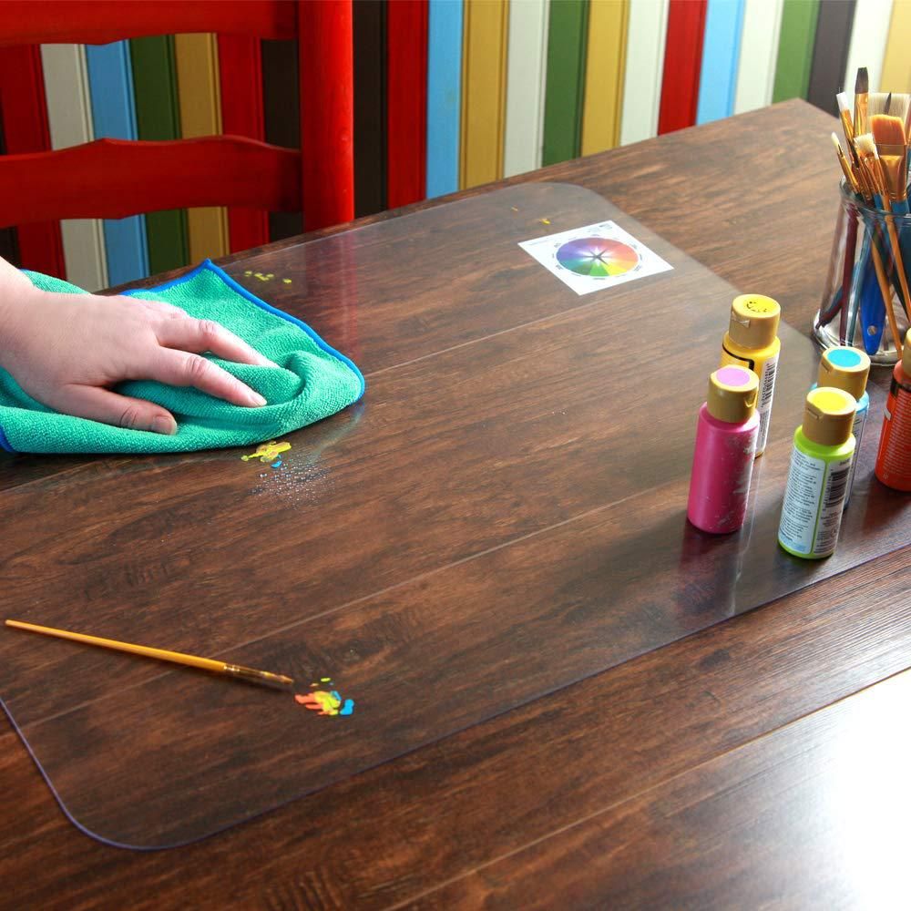 Transparent plastic dining table cover with protective mat for wooden furniture, ideal for baby and kids' pretend play.