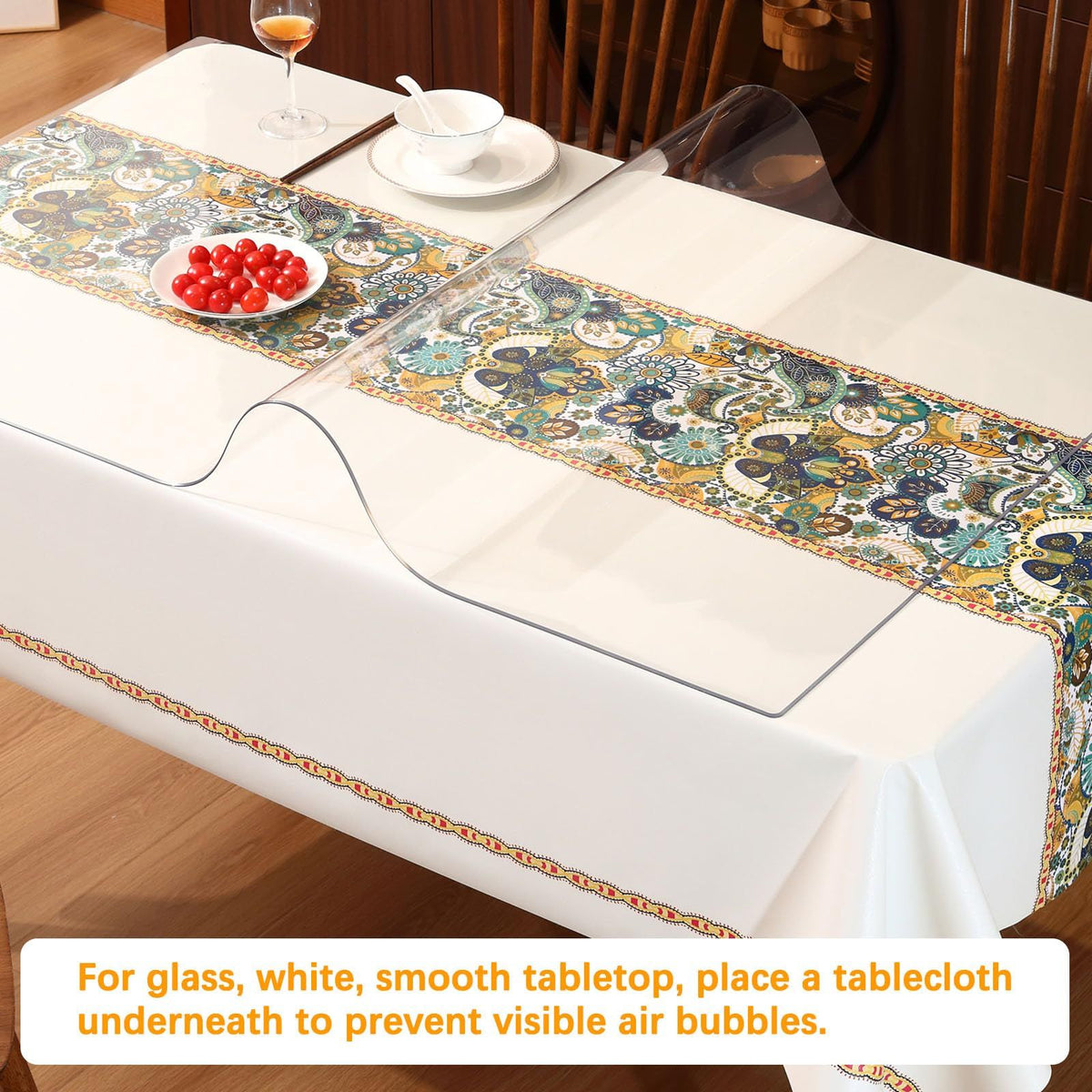 Transparent plastic dining table cover by Everything Baby, protecting wooden tables with a clear tablecloth and mat for kids' pretend play.
