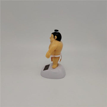 Sumo wrestler solar-powered swinging dashboard ornament for kids' ride-on cars, featuring a playful, solar-powered figure in motion.