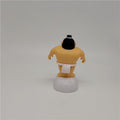 Sumo wrestler solar-powered swinging dashboard ornament for ride-on cars, featuring a playful design by Everything Baby.