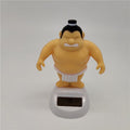 Sumo wrestler solar-powered dashboard ornament for car interior, decorative toy for kids' ride-on cars by Everything Baby.