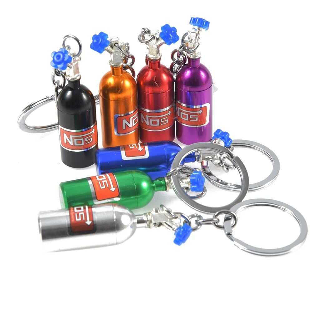Colorful 7-piece motorcycle rider girl and boy keychain set by Everything Baby, featuring fun motorcycle-themed designs.