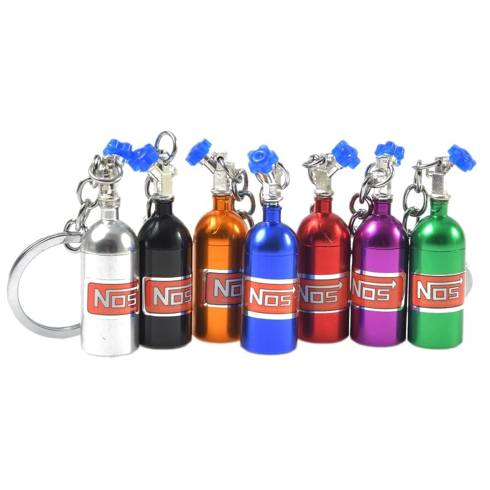 Colorful 7-piece motorcycle-themed keychain set featuring girl and boy rider designs, perfect for car lovers and gifts.