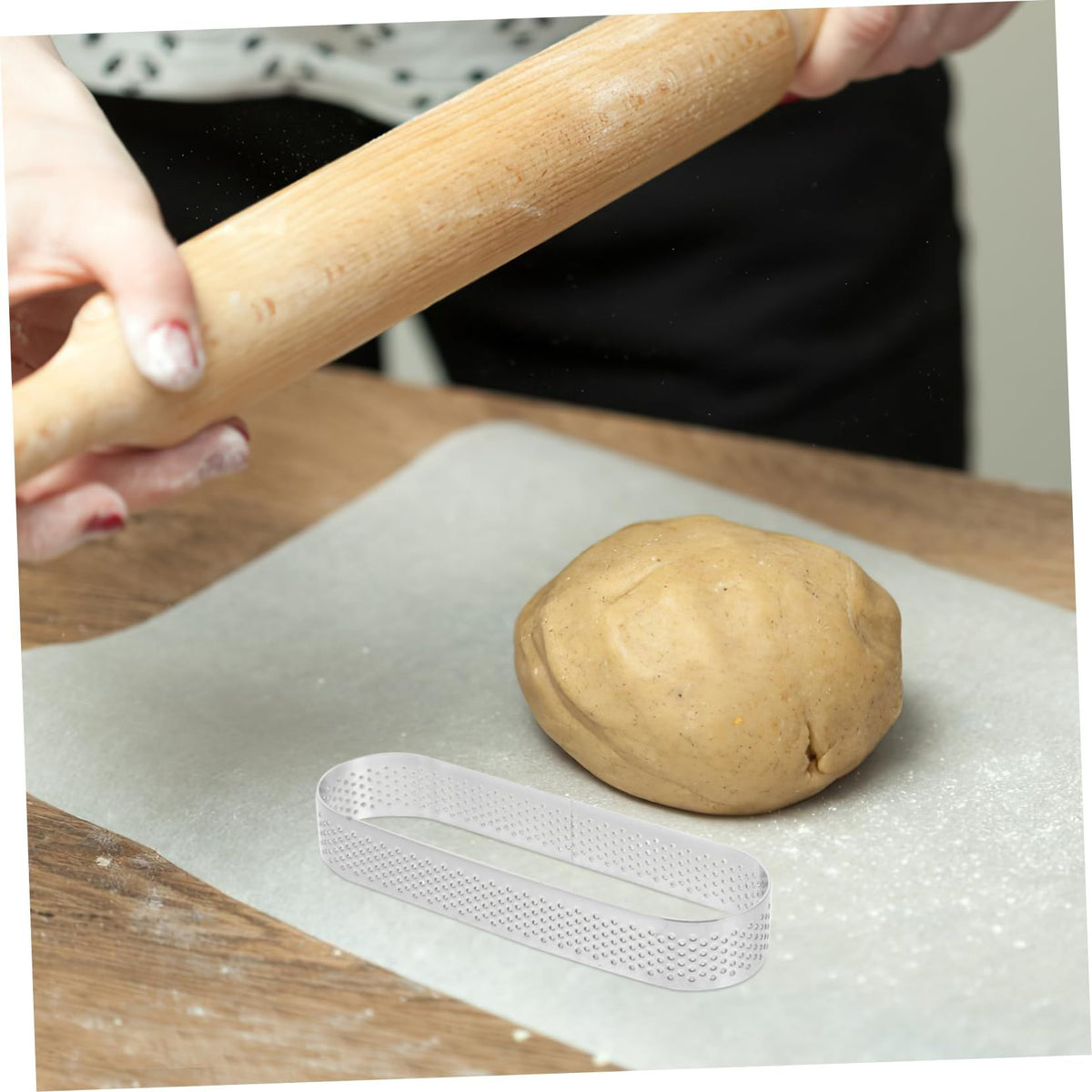 Stainless steel tower ring baking mold, versatile cake and mousse ring for baking and pretend play in a household kitchen setting.