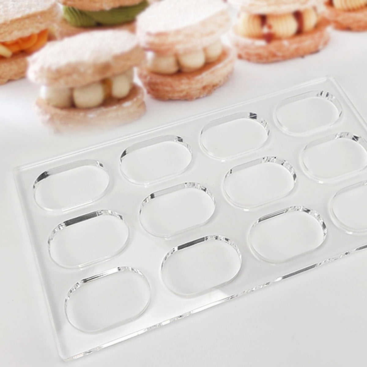 Transparent oval cake mold for baking, ideal for French pastries and cake decoration, by Everything Baby.