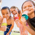 Four colorful popsicle holders for kids, designed to catch drips from frozen popsicles and ice creams.