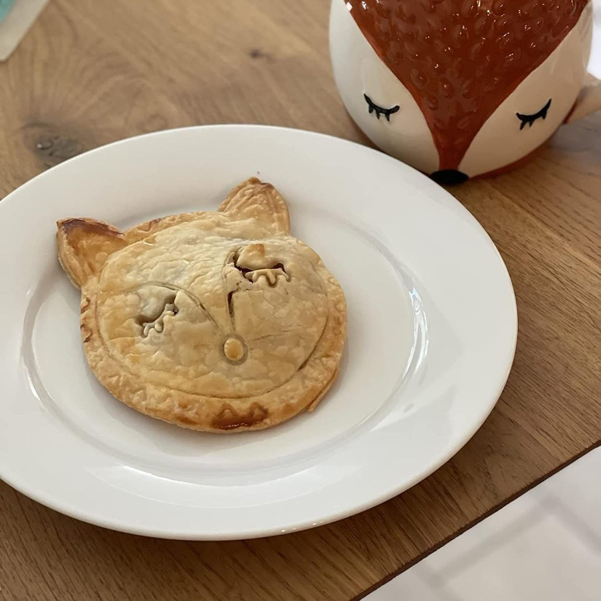 Set of two fox and owl-shaped mini hand pie molds for children’s pretend play, perfect for making forest animal-shaped pies.