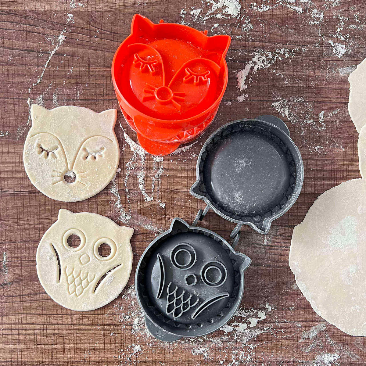 Set of two forest animal mini hand pie molds featuring fox and owl shapes for children's pretend play and party treats.