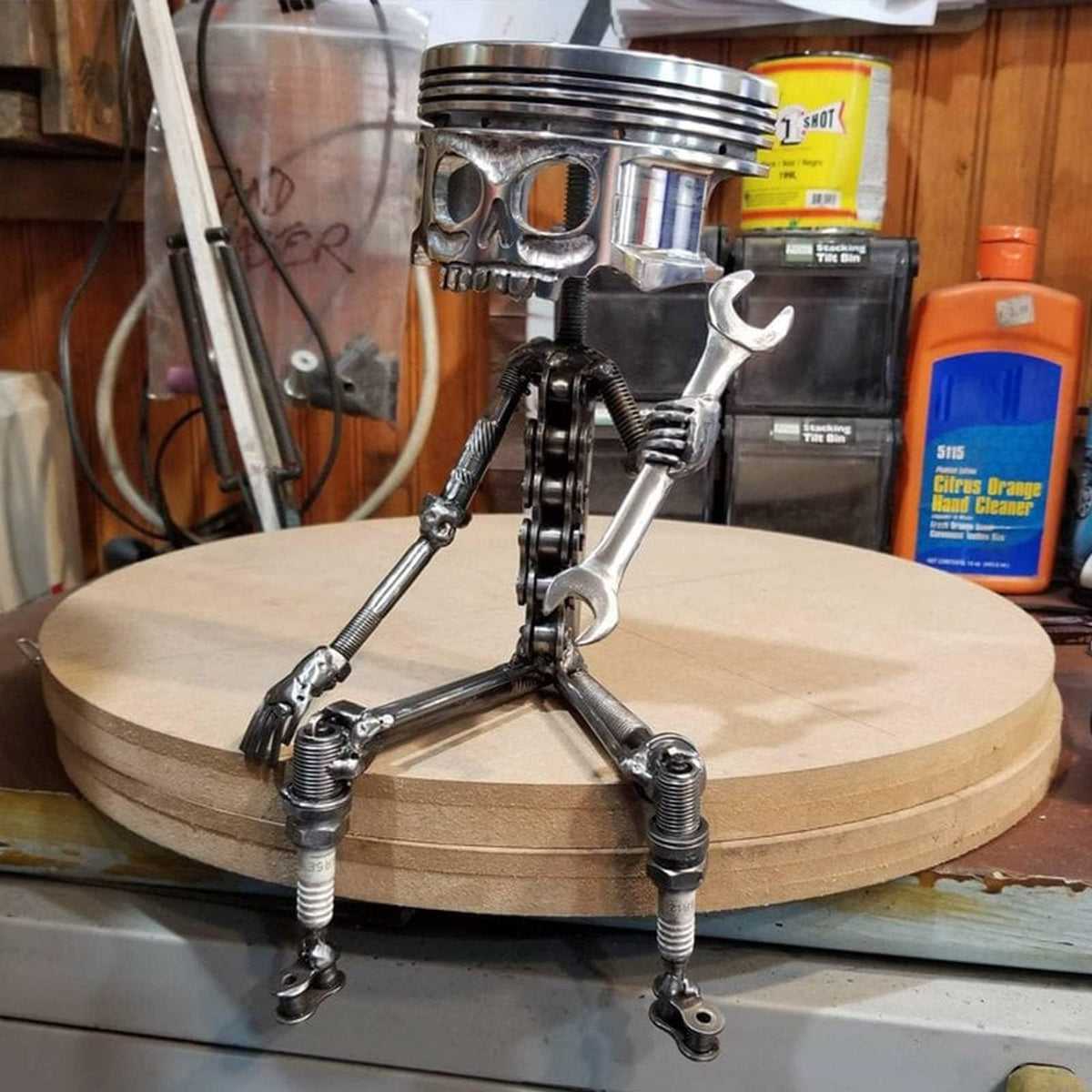 Handmade carved piston skull face sculpture in metal art style, featuring a detailed skeleton face for unique decorative appeal.