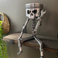 Handmade carved piston skull face sculpture, metal art figurine with detailed skeleton face design for decorative display.