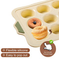 Beige silicone muffin pan with 12 nonstick cups, ideal for baking muffins or cupcakes, made by Everything Baby.