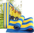 Kids and teens playing on a colorful teamwork game run mat for team building and pretend play by Everything Baby.