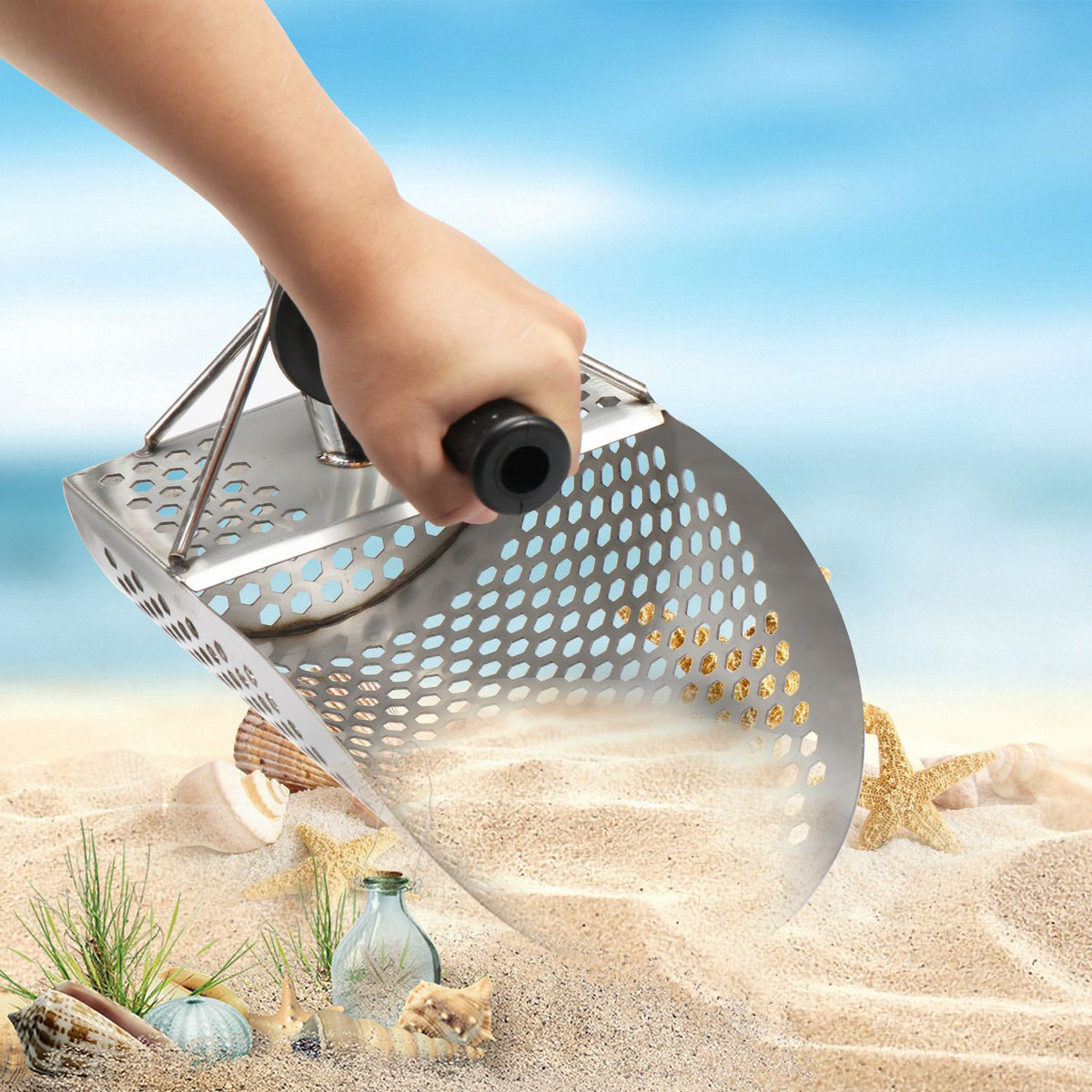 Heavy duty stainless steel sand scoop for metal detecting, ideal for beach finds and outdoor digging with a durable design.